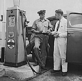 A war worker buys gasoline in Rochester.